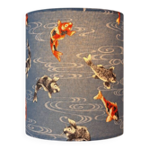 Handmade lampshade covered with Japanese fabric featuring car patterns.