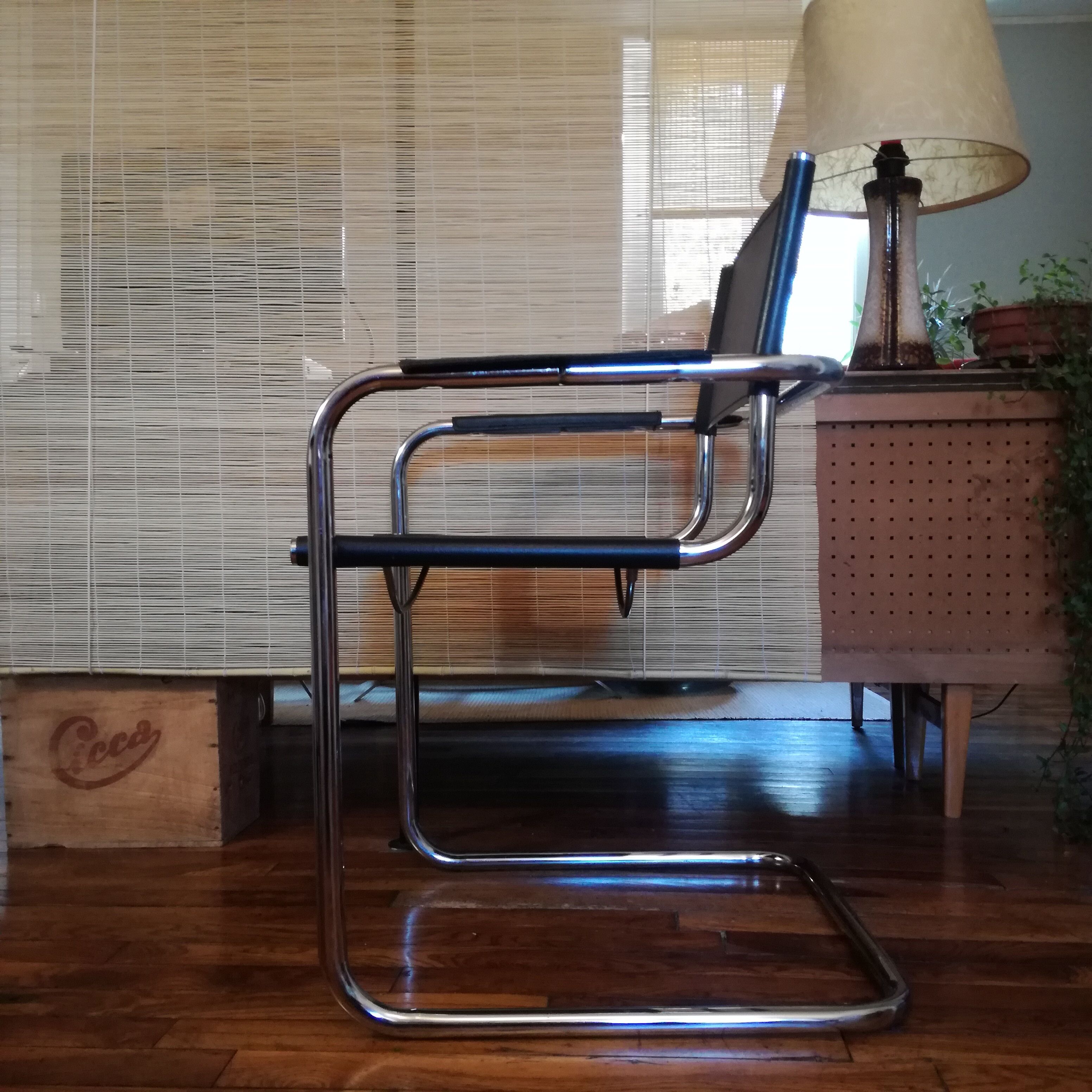 Black leather cantilever armchair