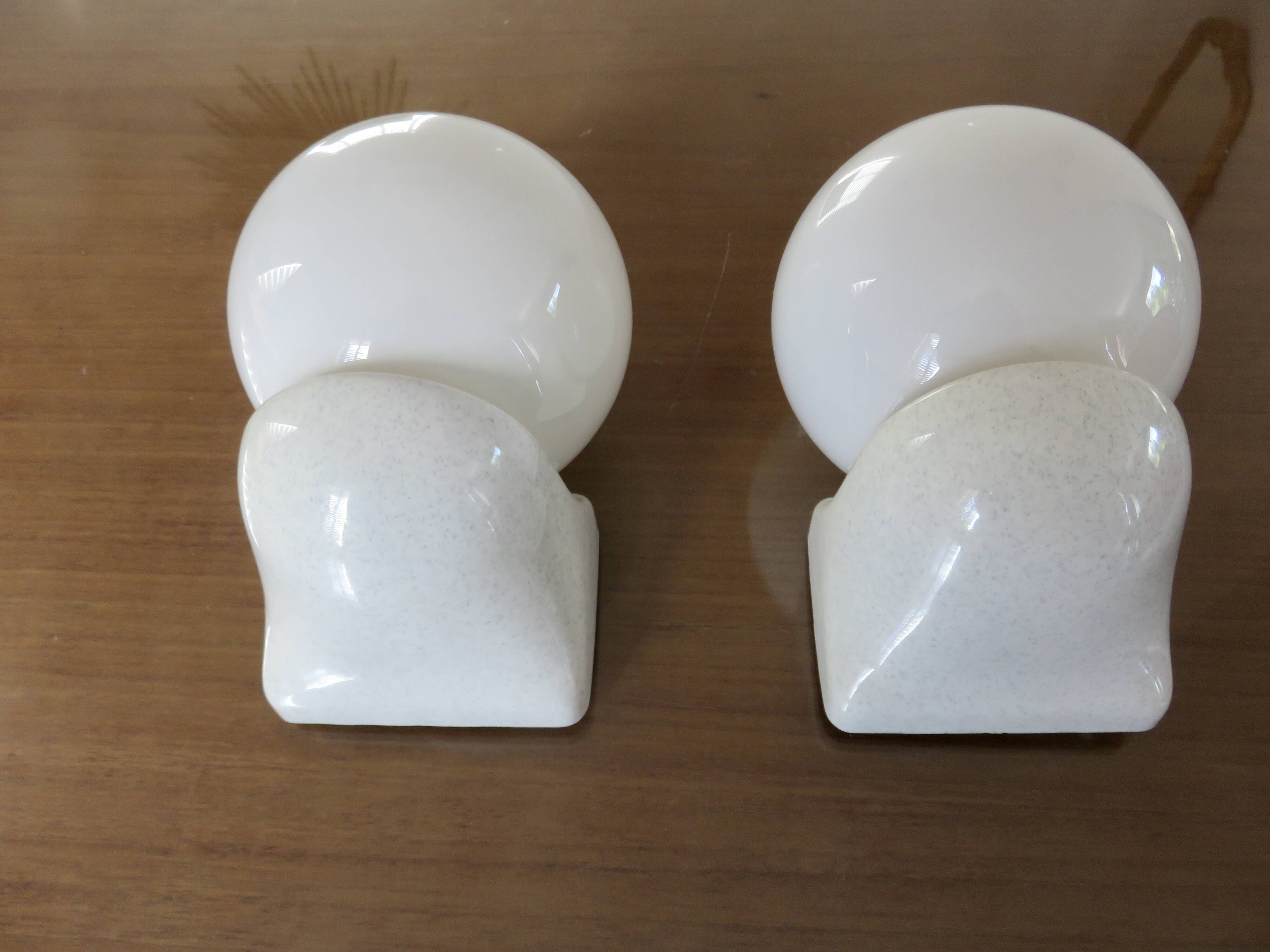 Pair of streamline opaline wall lights from the 80s