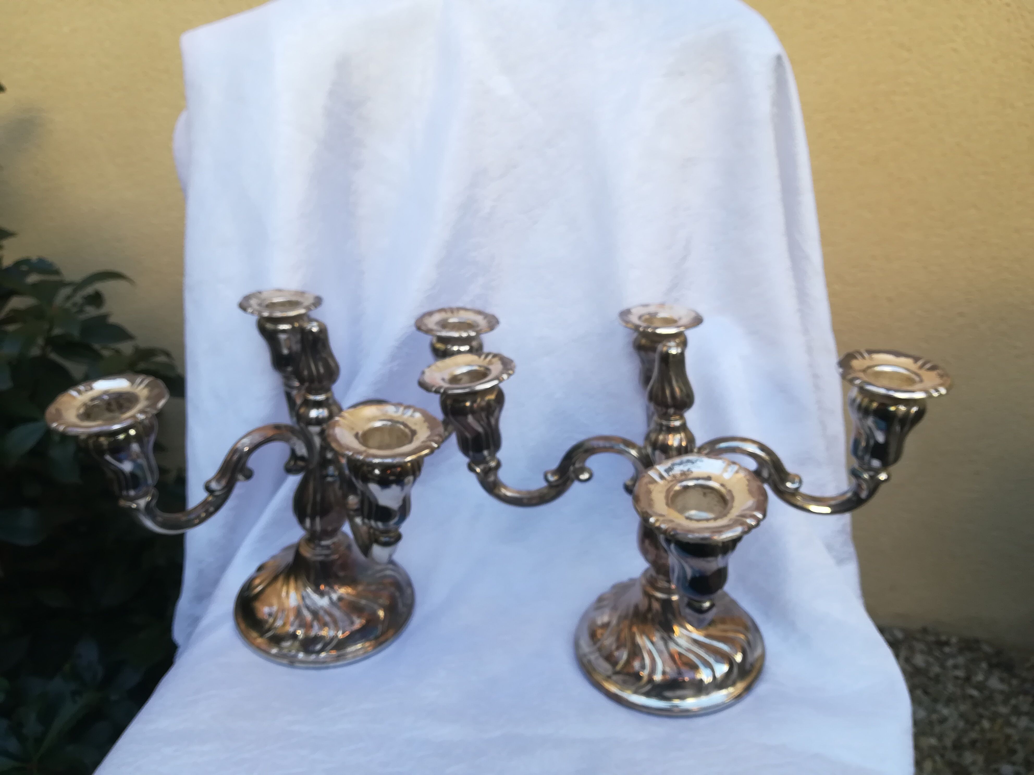 Pair of candlesticks in silver metal