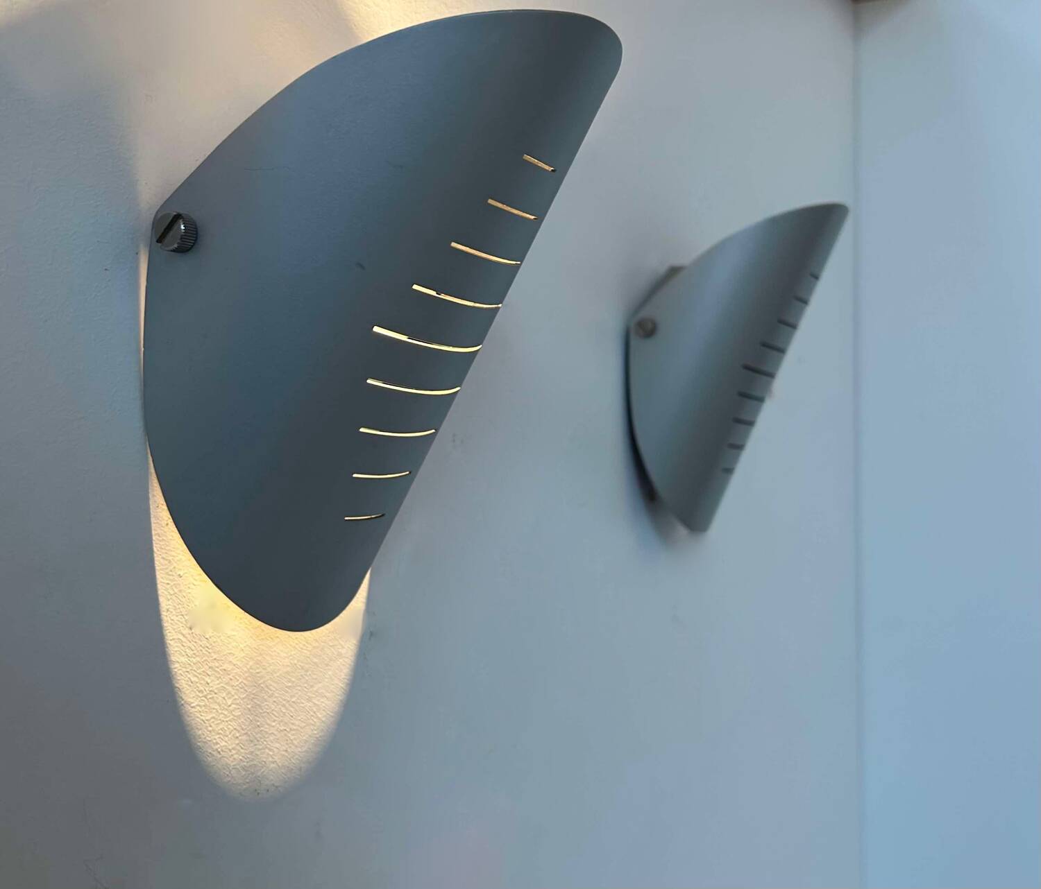 Pair of vintage adjustable wall lights, curved striated metal, France 1980