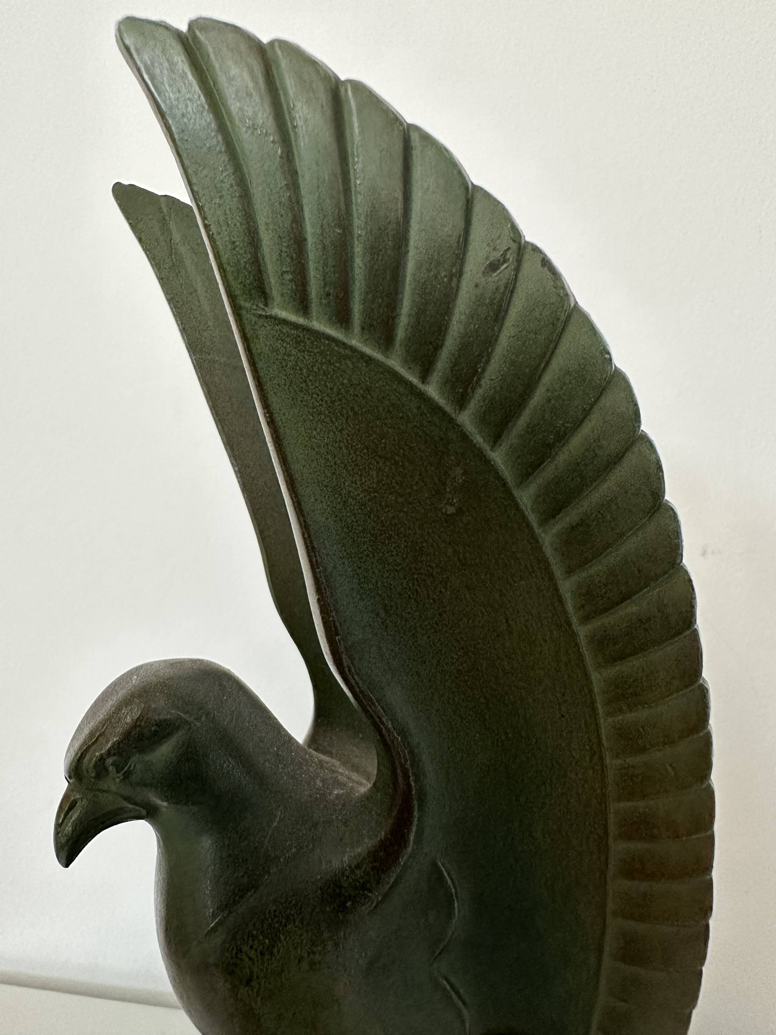 Pair of eagle bookends in green patina regula with rosewood base
