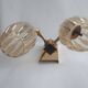 Golden bronze wall lamp with mermaids for an old bathroom.