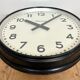 Black swiss industrial wall clock from inducta, 1960s