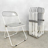 Plia' chairs by Giancarlo Piretti for Castelli with a table