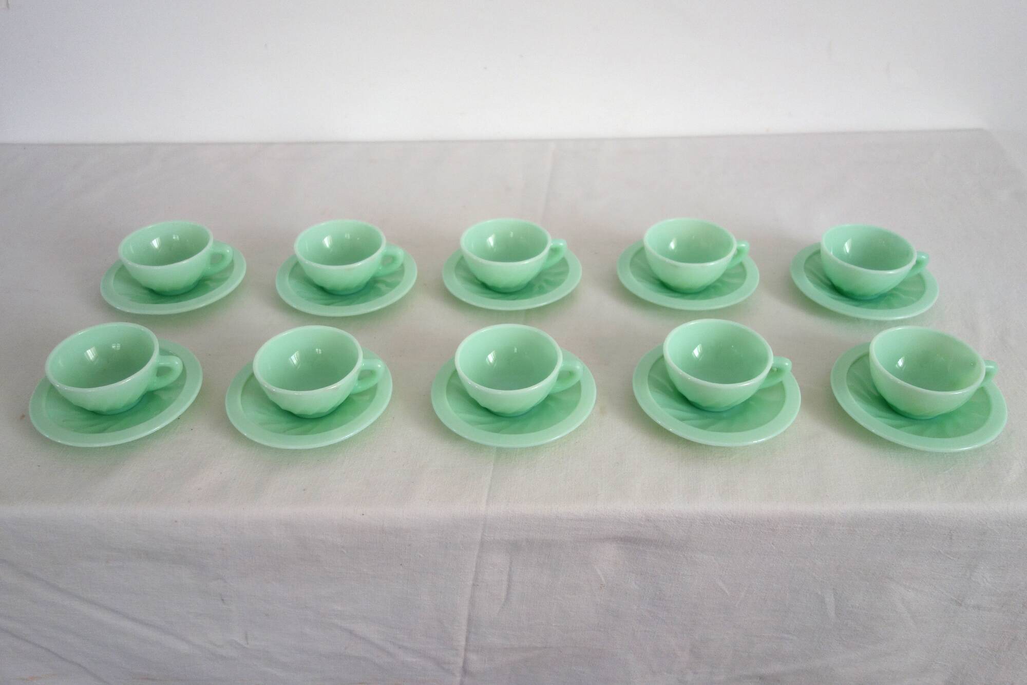 10 almond green opaline cups and saucers from the 50s