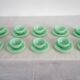 10 almond green opaline cups and saucers from the 50s