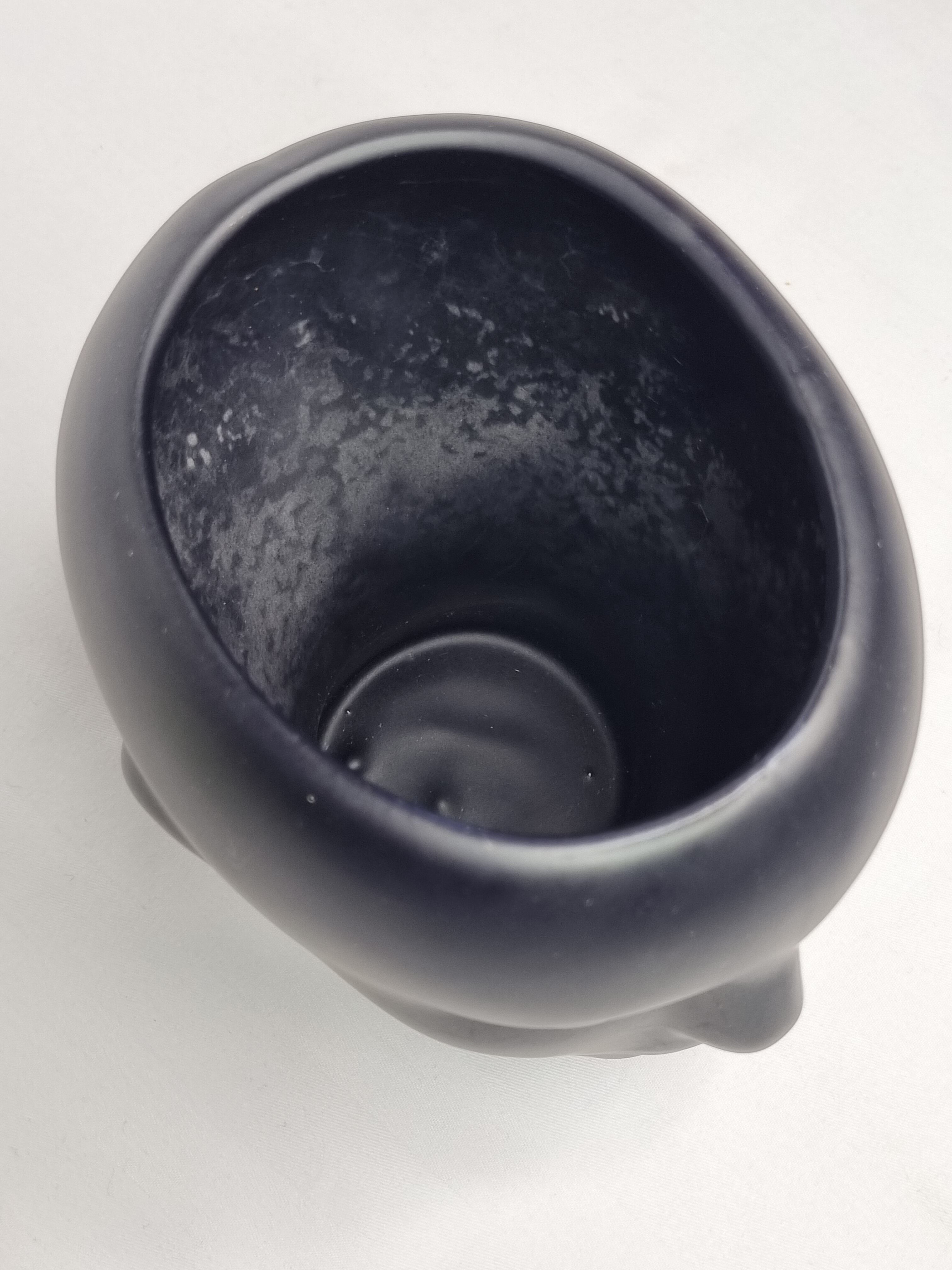 Anthropomorphic pot cover in matt black glazed ceramic, 80s