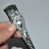 Rocaille sugar tongs in silver metal with lion claw medallion