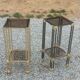 Pair of Hollywood Regency side tables in gold metal and smoked glass.