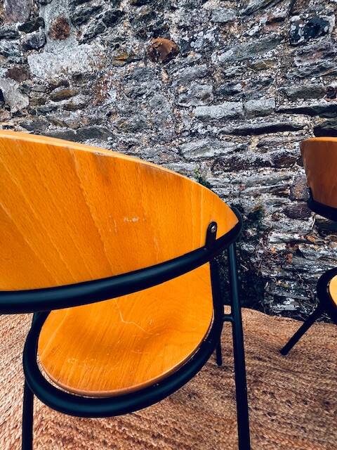 Pair of wooden and black metal chairs