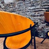 Pair of wooden and black metal chairs