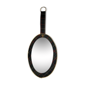 Vintage oval mirror with tartan decoration.