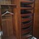Large English-style wardrobe with a curved front and three doors.