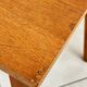 Old wooden desk or side table with compass legs