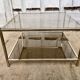 Square brass coffee table and smoked glasses
