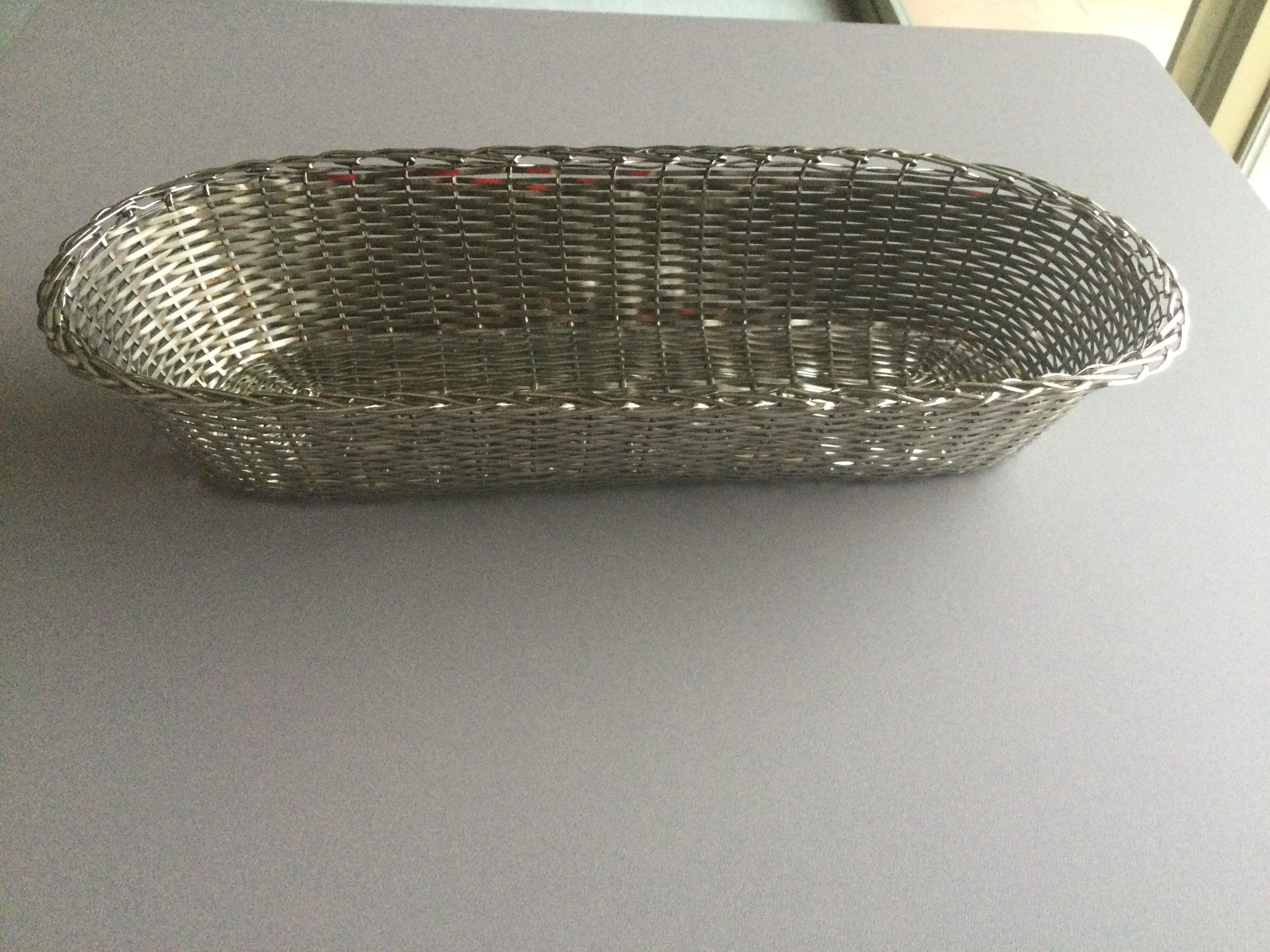 Braided silver metal bread basket