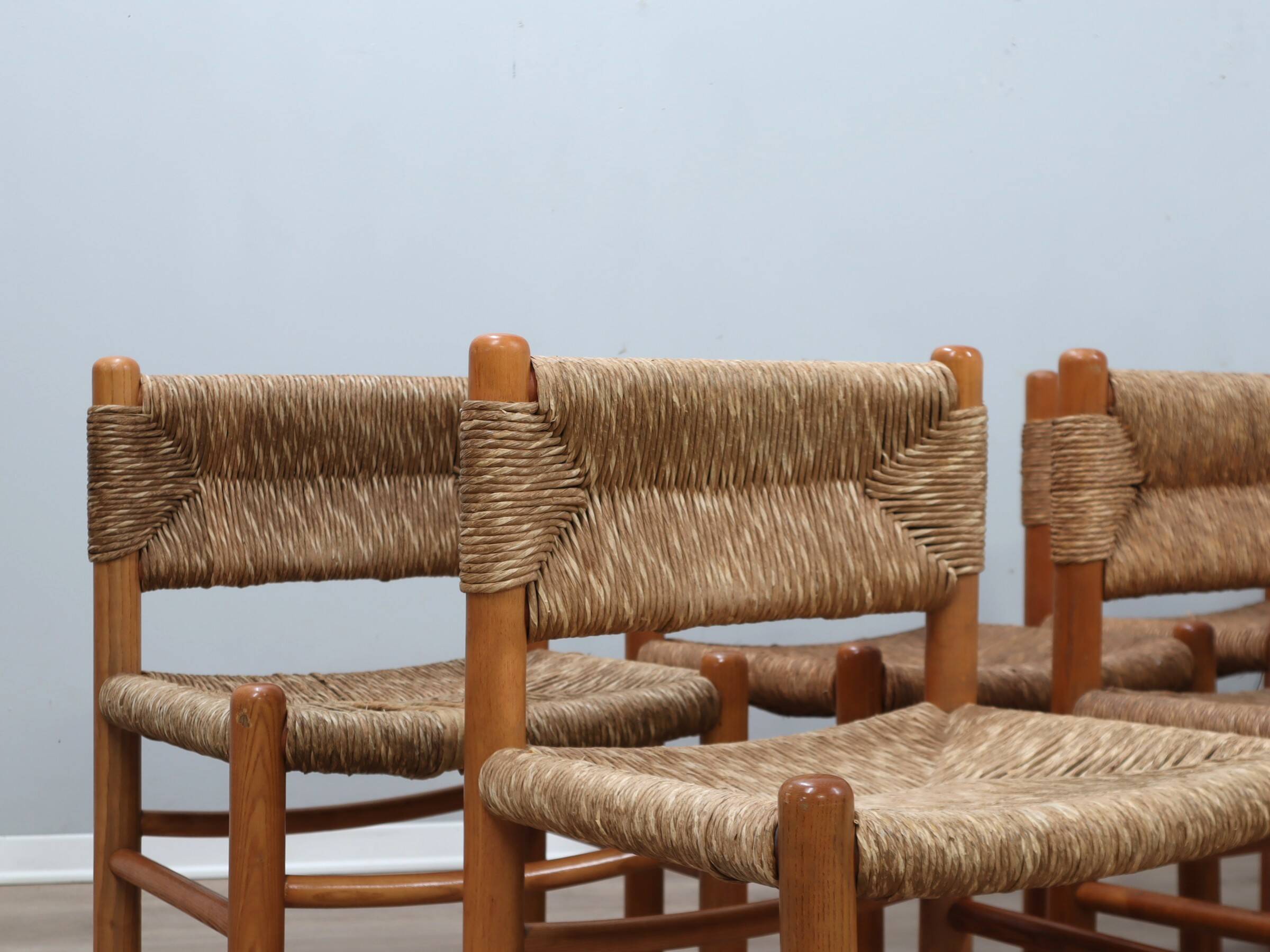 Set of 8 chairs 1960s Charlotte Perriand Style woven straw & wood