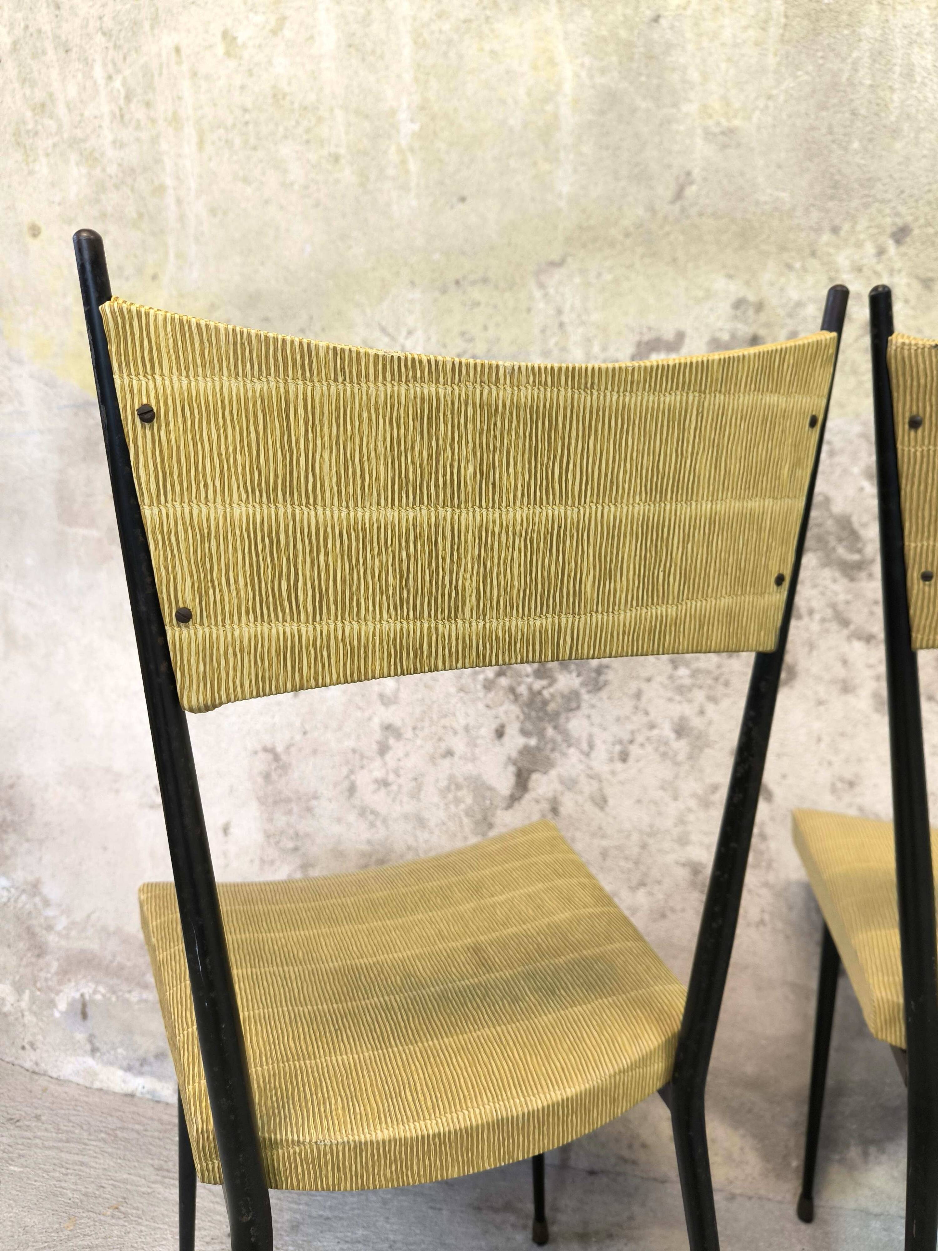 Three vintage chairs in the style of Colette Gueden.