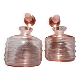 Two pink glass bottles