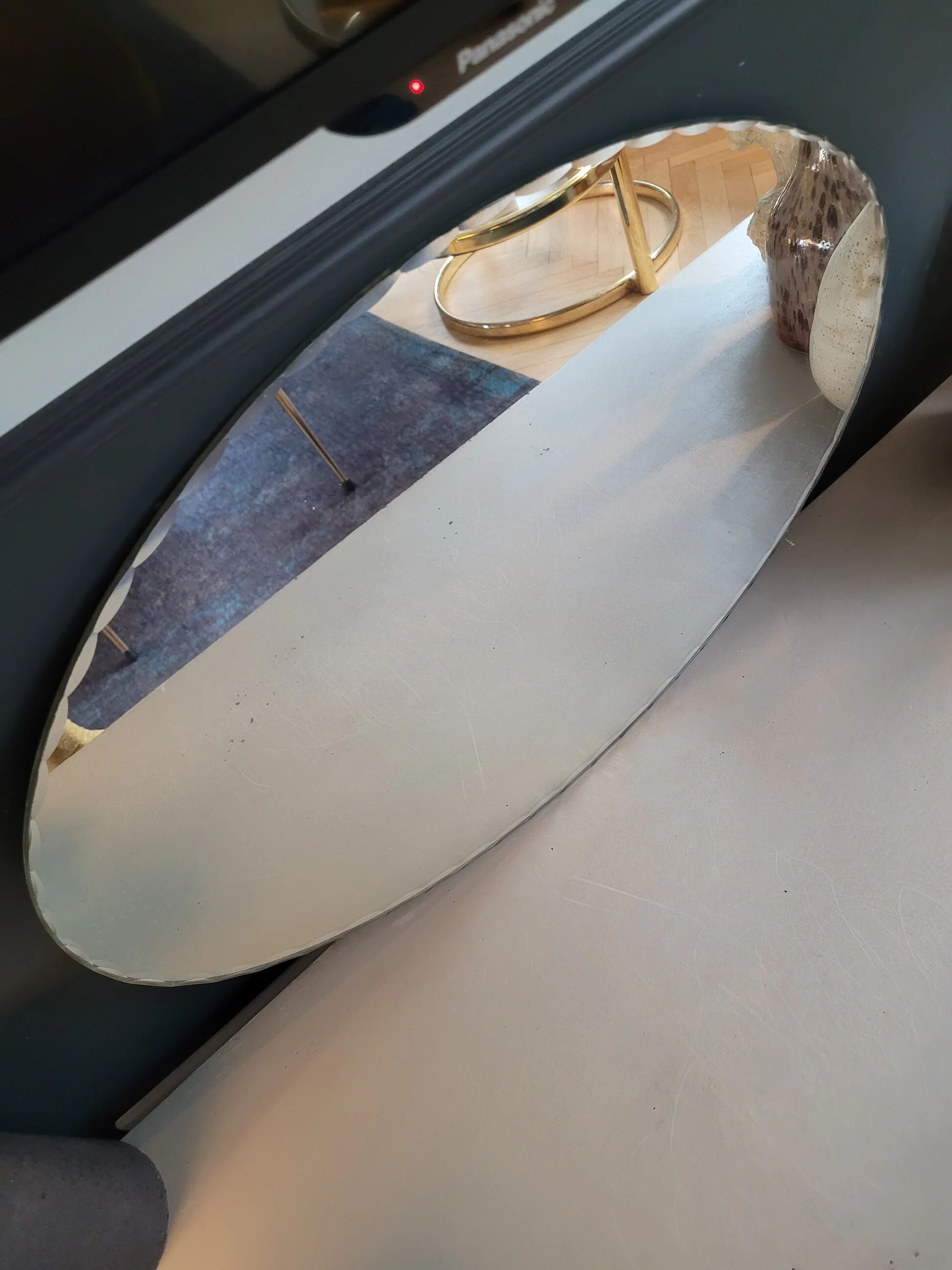 Antique oval mirror with chiseled edges