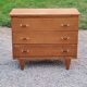 Vintage chest of drawers in golden oak from the 50s with 3 drawers and spindle-legged shelf