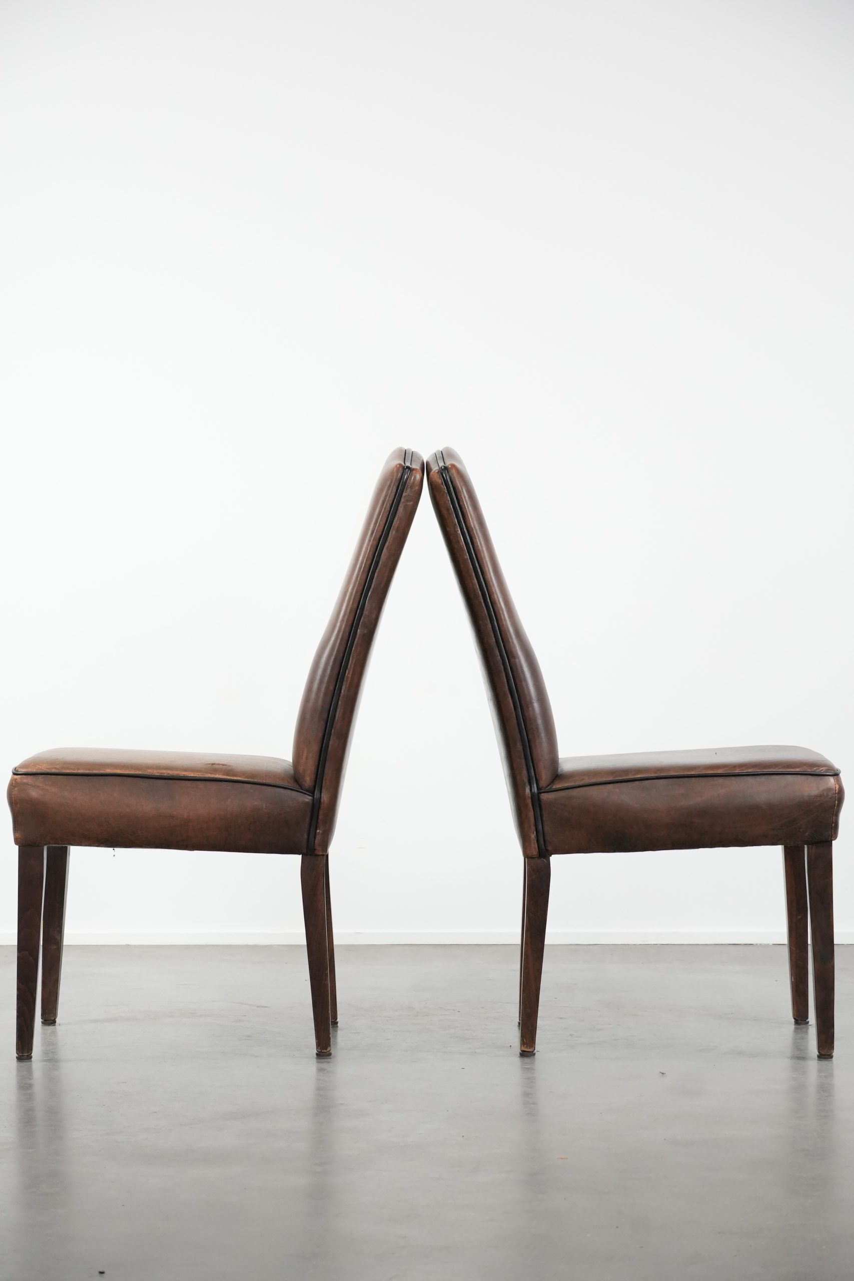 Great set of 8 stylish vintage sheepskin dining chairs with character