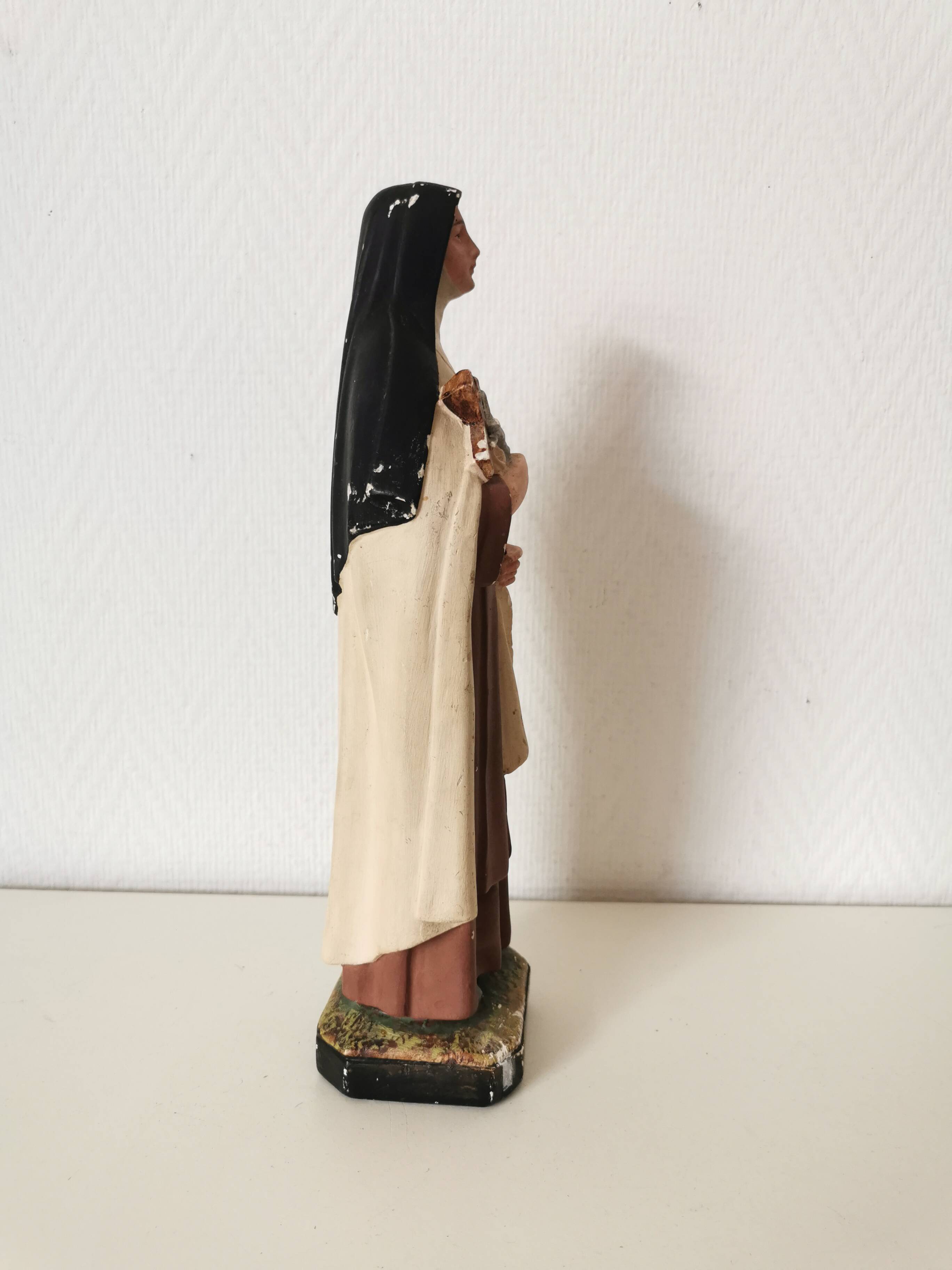 religious statue of Saint Therese of Lisieux in painted plaster