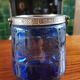 Old ice or biscuit bucket made of golden decor blue glass