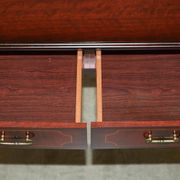 Small console with two drawers in hardwood finish.
