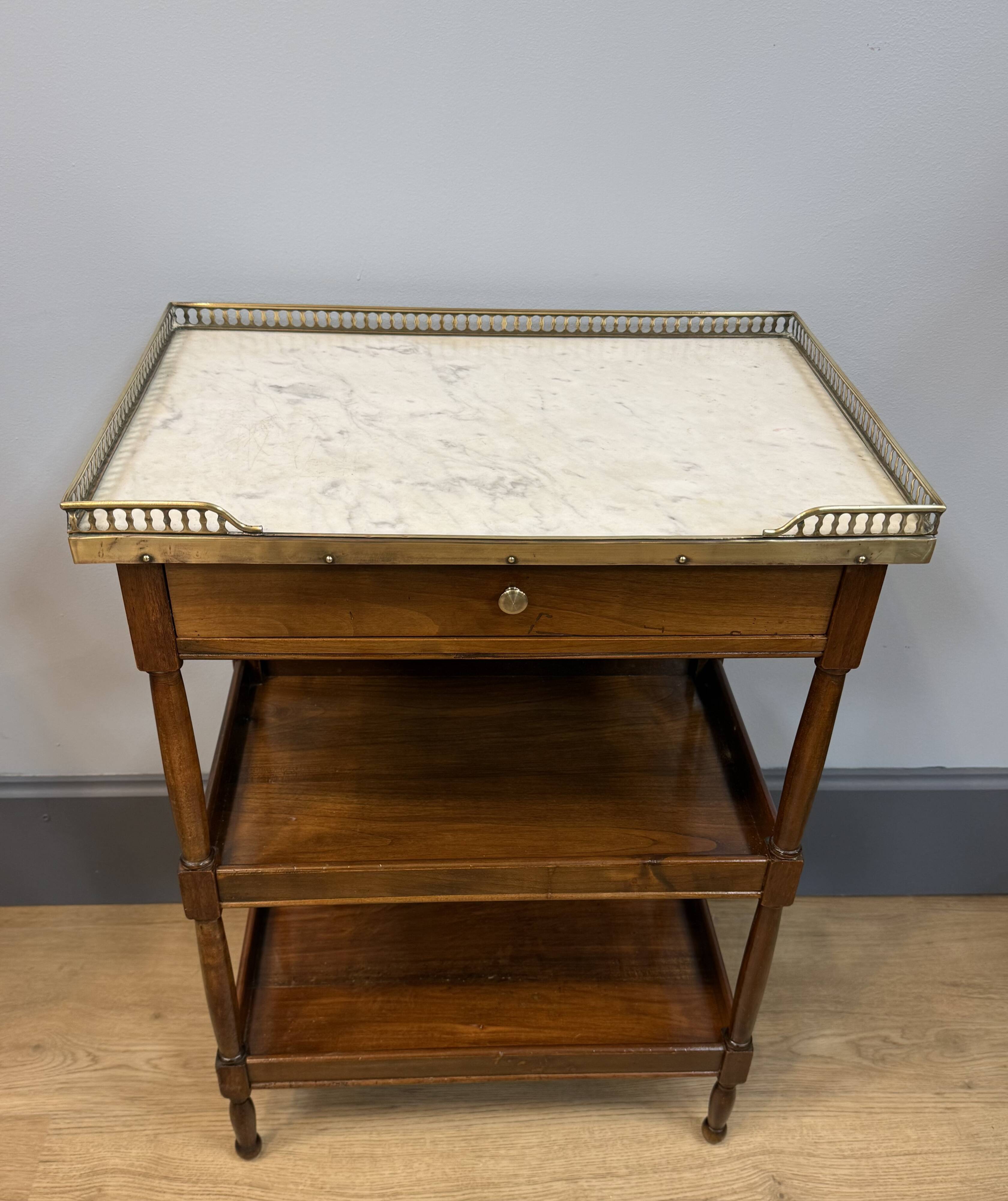 Small mahogany side table in Louis XVI style.