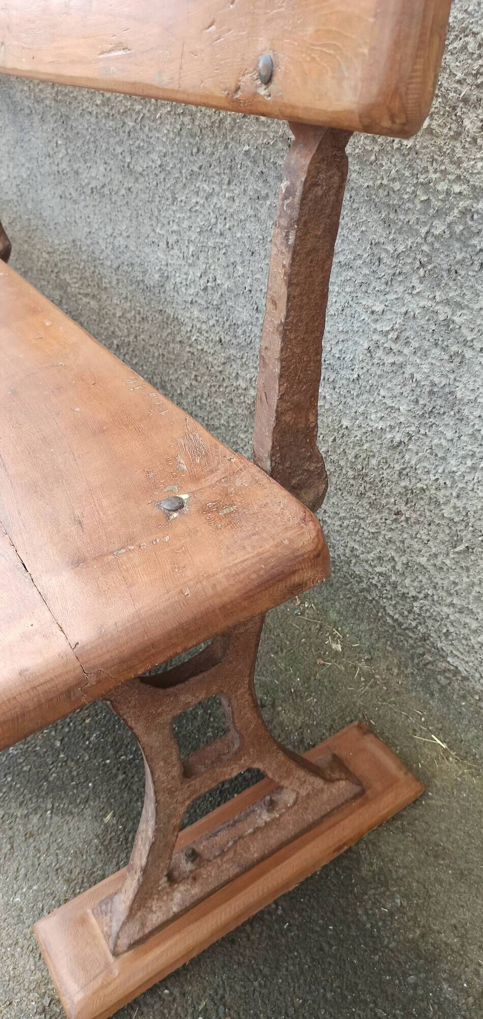Old wooden bench with cast iron base
