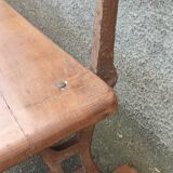 Old wooden bench with cast iron base