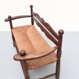 Vintage bench with wooden backrest and structure and mulched seat