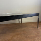 Large designer coffee table from the 70s in chrome, smoked glass, and faux leather.