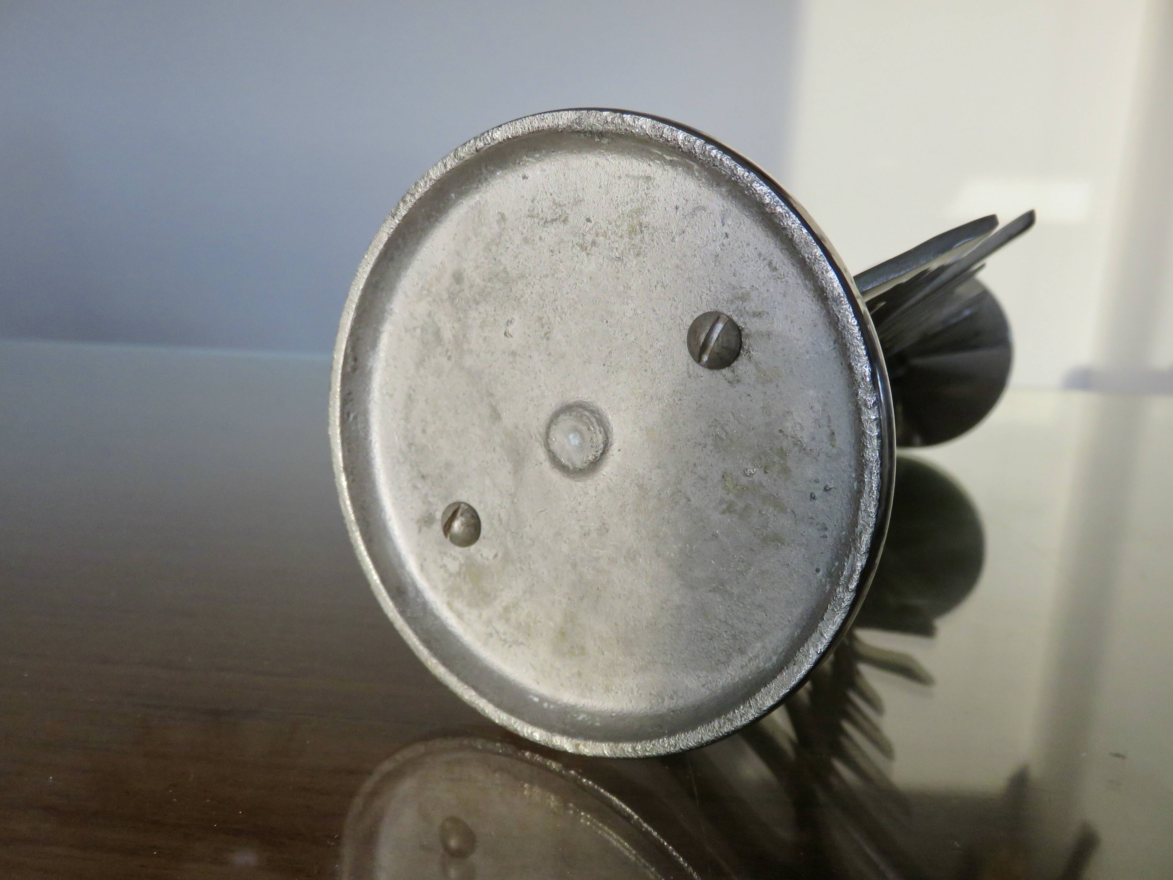 Ethnic “skeleton” candle holder in nickel-plated brass from the 80s