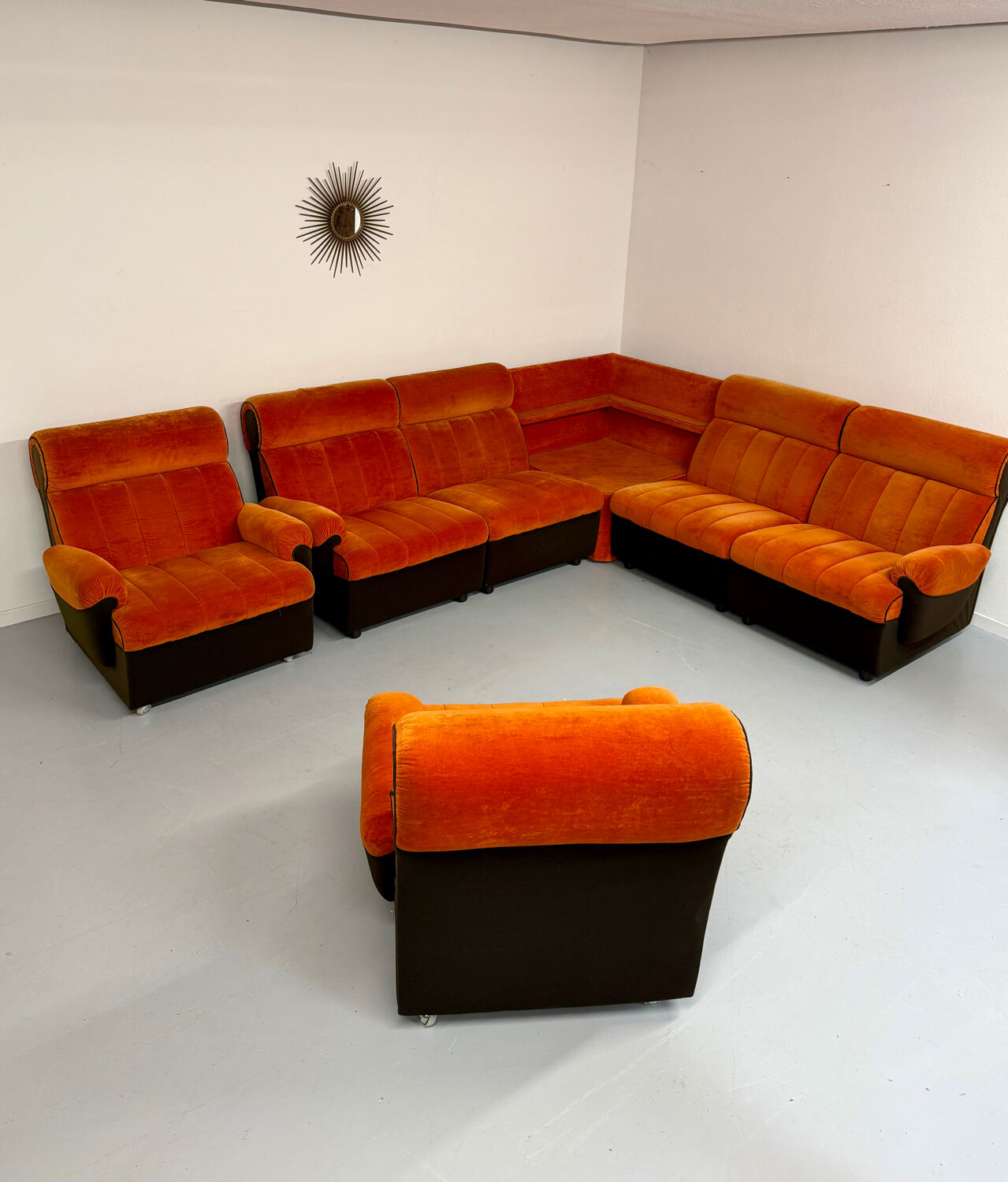 Modular vintage orange corner sofa, 1970s pop design.