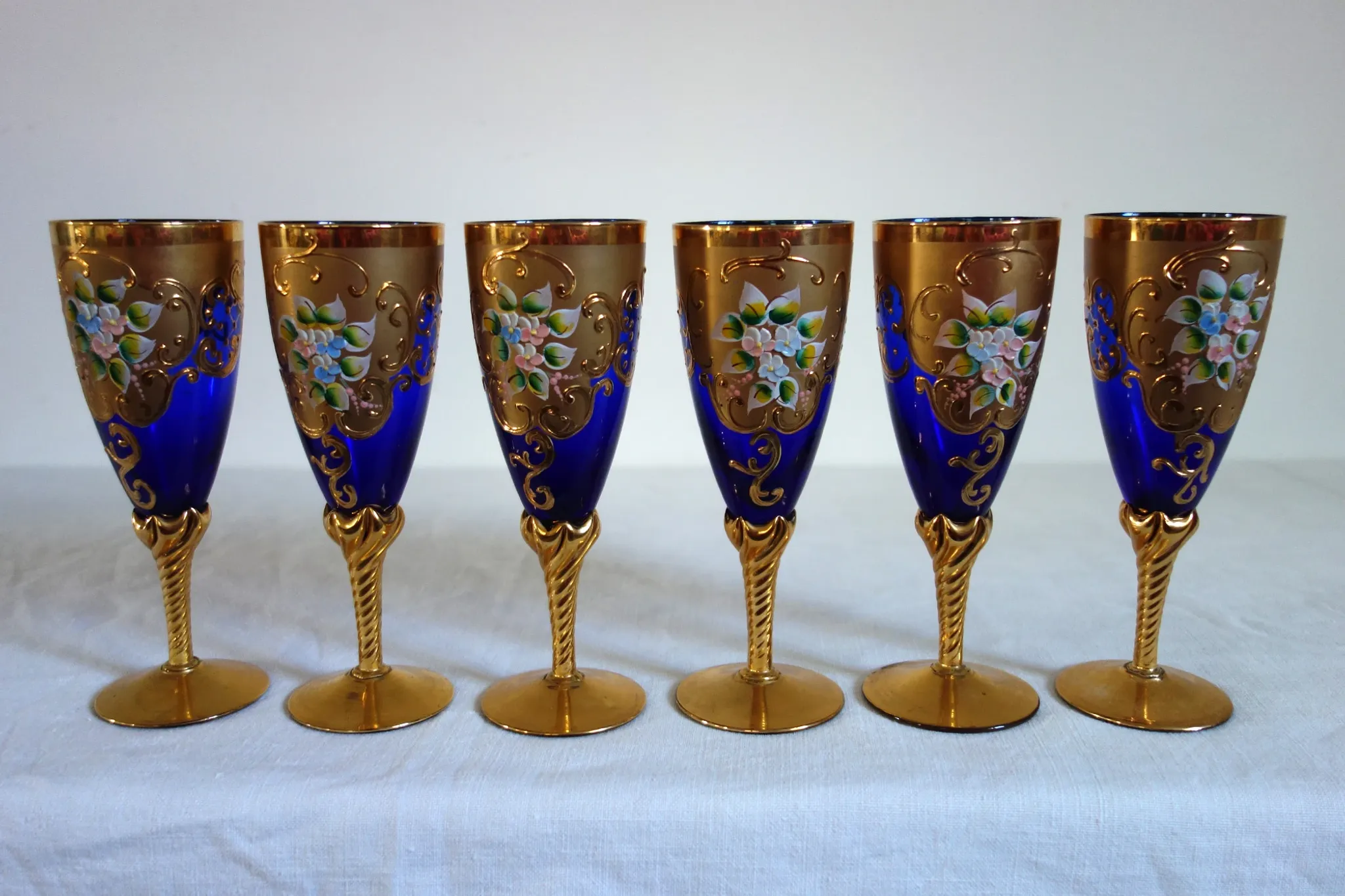 12 cobalt blue and gold Murano glass flutes, mid-20th century.