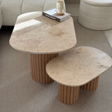 Oval coffee table duo travertine and raw fluted wooden legs.