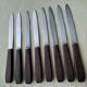 Set of 8 vintage stainless steel and brown bakelite table knives