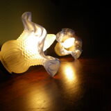 Wall sconces with opalines in the shape of corollas and black metal support