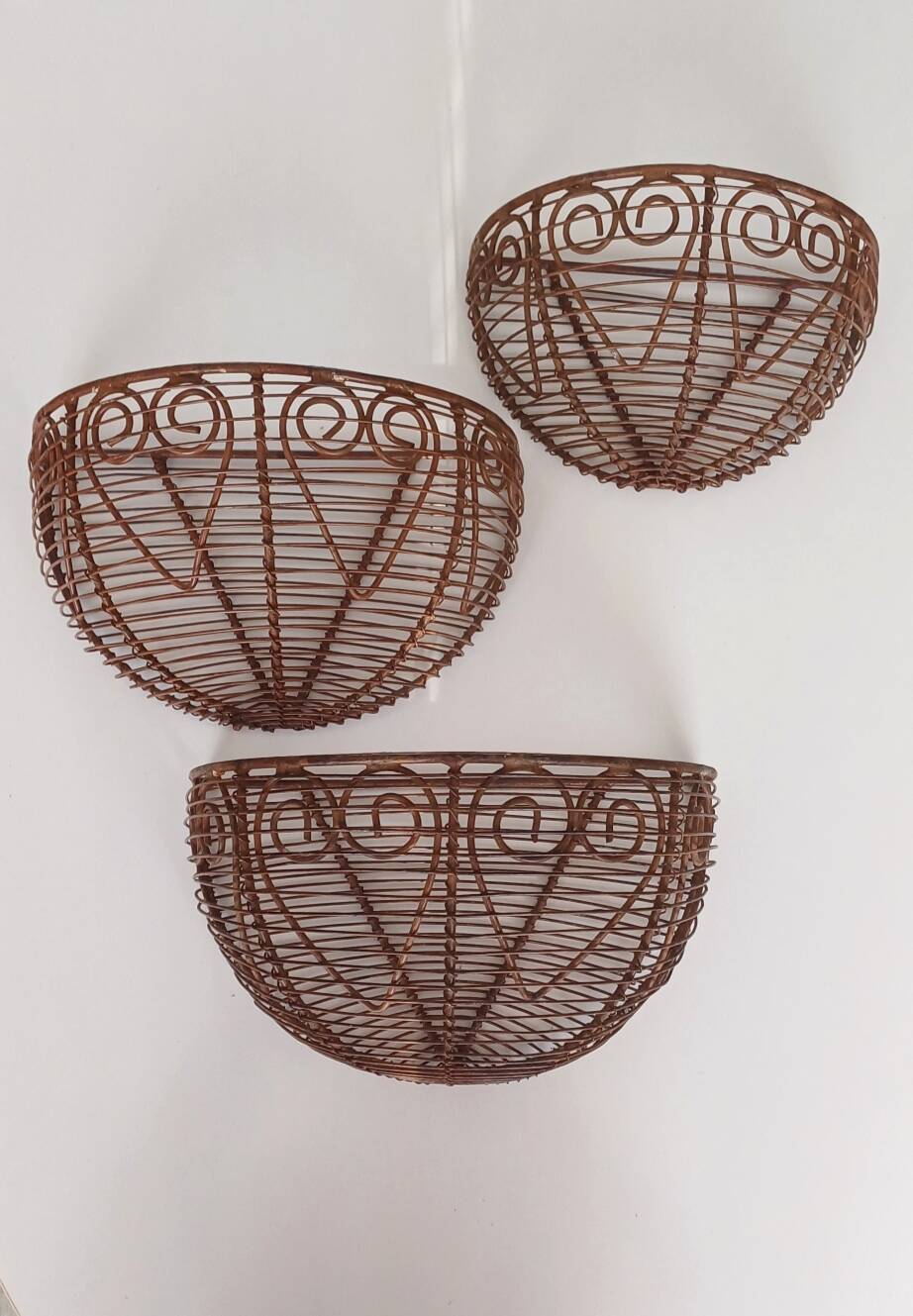 Wall-mounted plant baskets