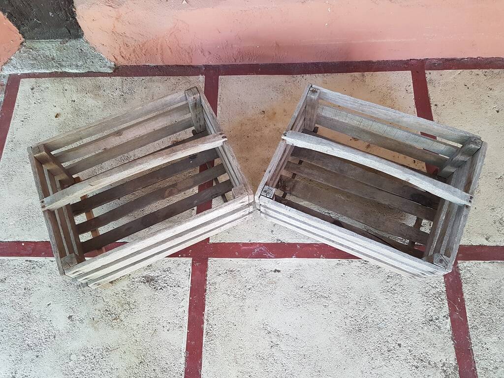 Pair of old fruit crates with wooden shelves