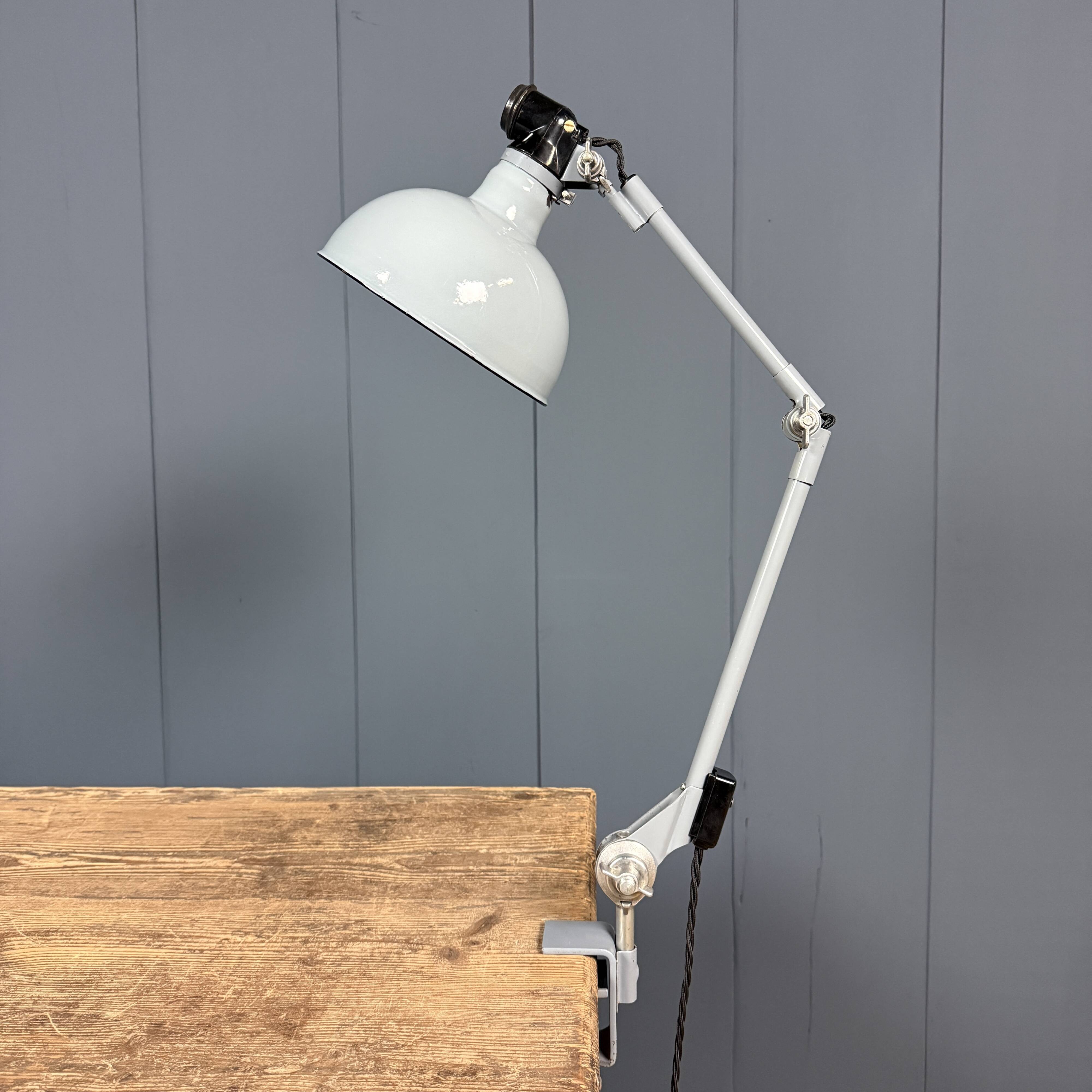 Light grey Rademacher clamp lamp with large enamel shade