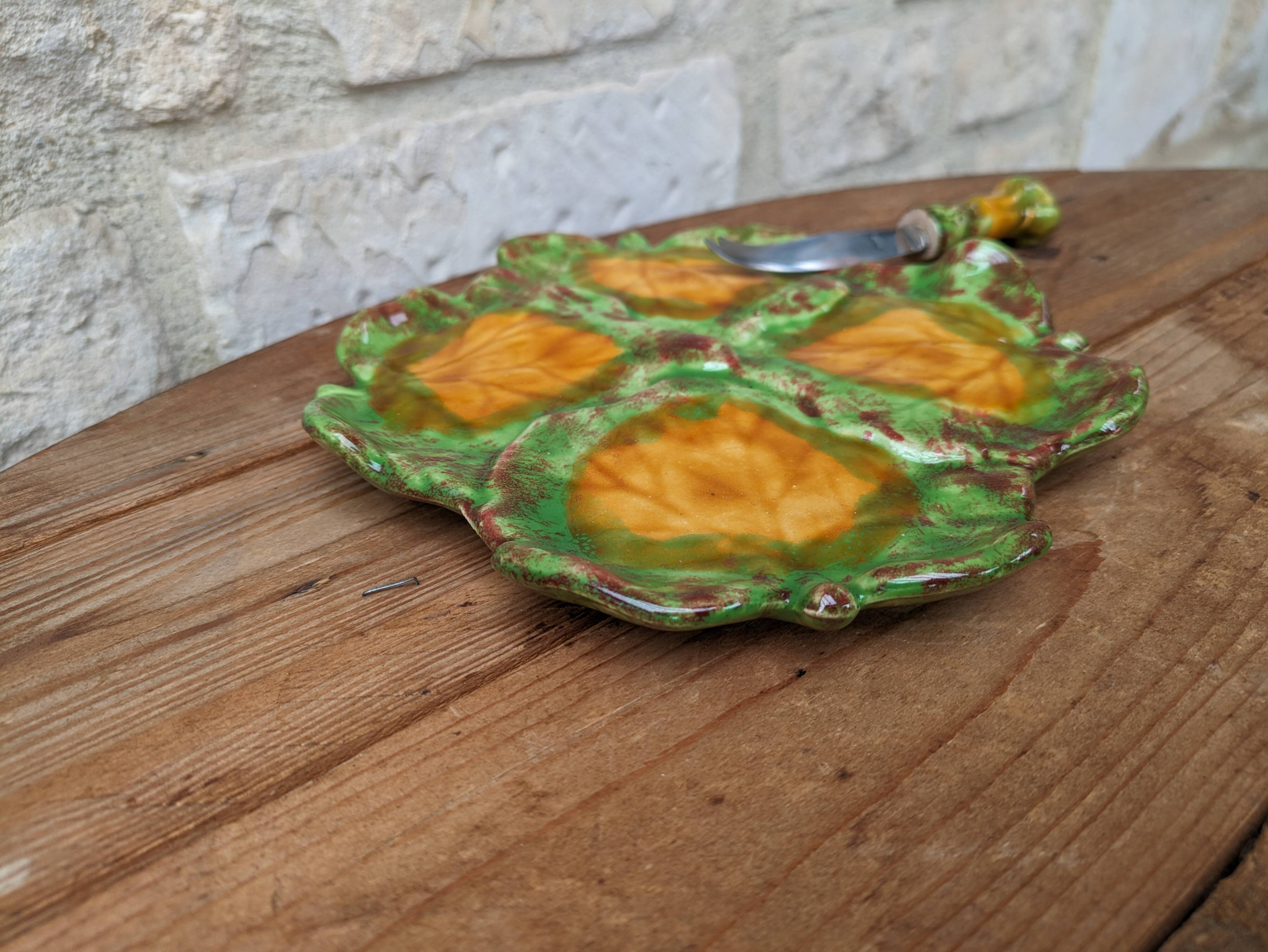 Antique colored ceramic cheese plate with knife