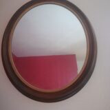 Oval mirror in wood and gold
