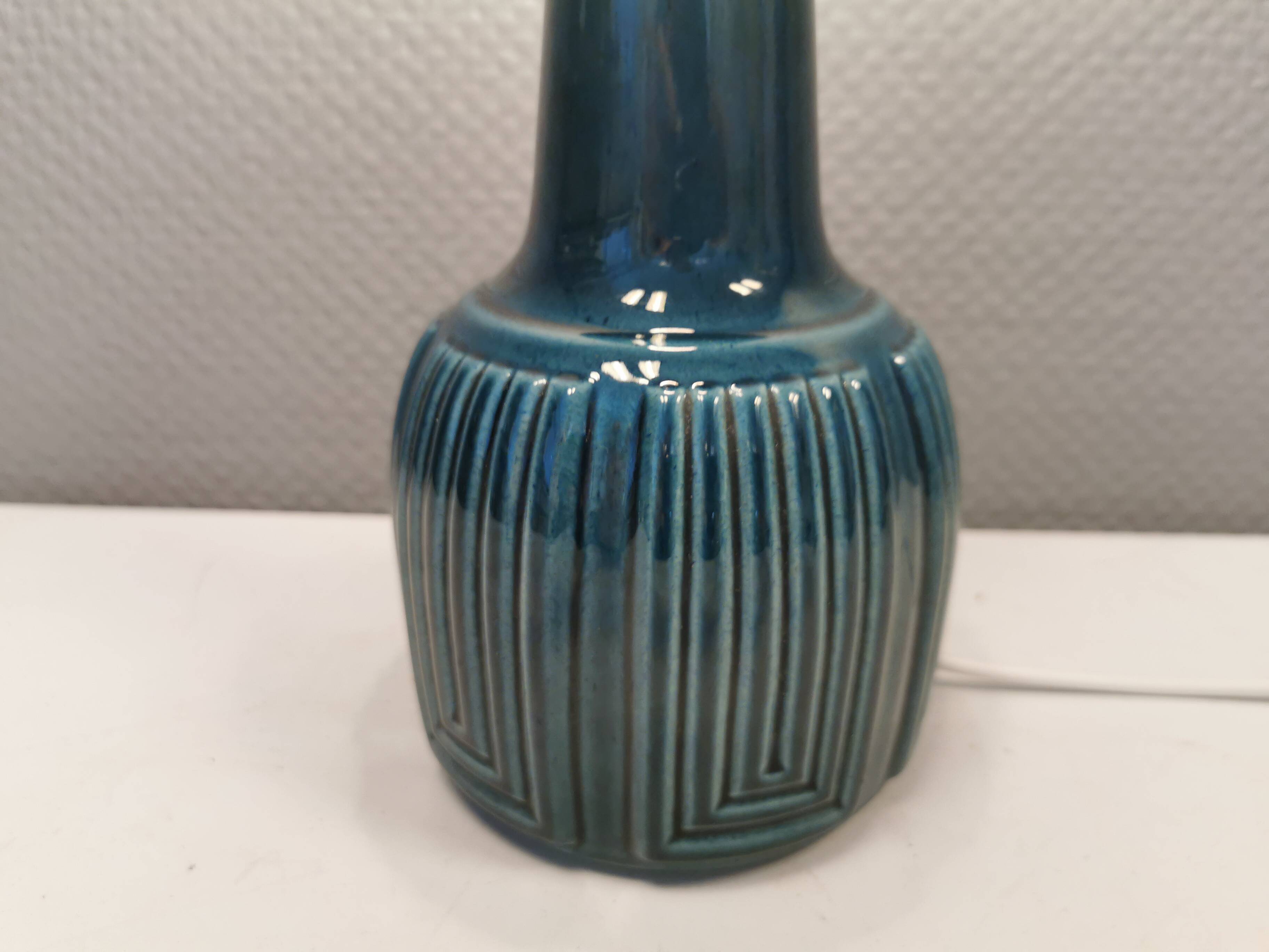 Elegant mid-century ceramic table lamp with an embossed pattern covered in mother-of-pearl glaze.