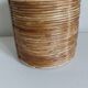 Rattan and brass pot cover