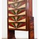 An Art Deco chest of drawers with five beech and rosewood drawers.