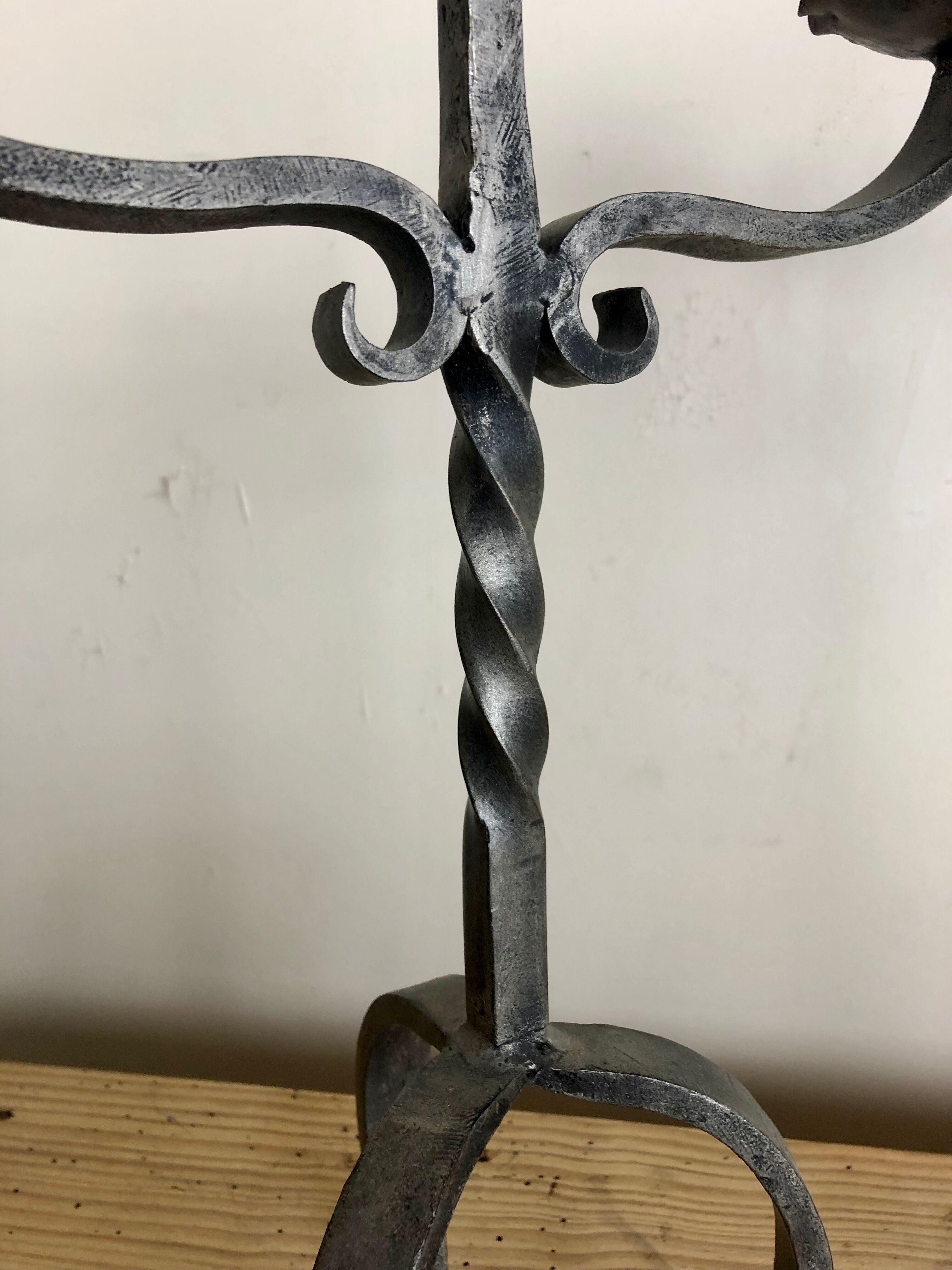 Pair of wrought iron candlesticks